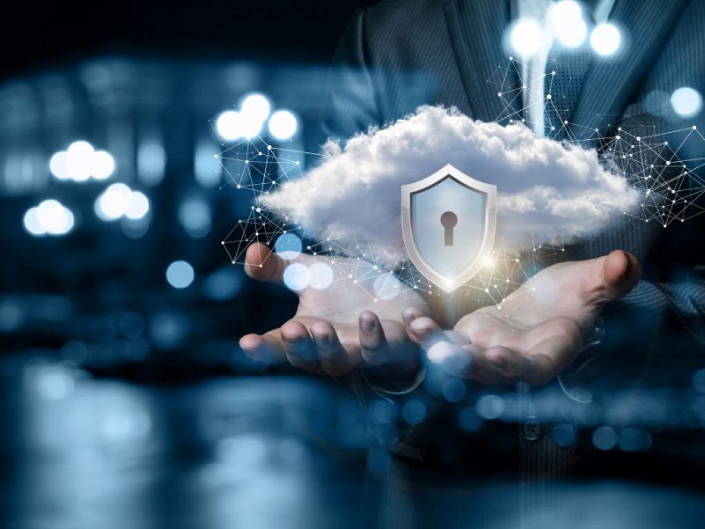 California IT professional securing cloud data with encryption tools, firewall protection, and cybersecurity monitoring dashboard.